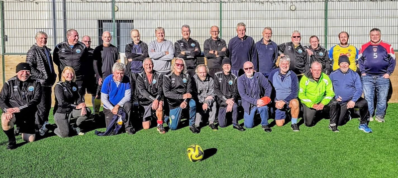 Replace with a landscape squad or social photograph showing GWFC's personality and inclusivity. Show a range of participants; prefer an informal club atmosphere over a formal competition lineup.